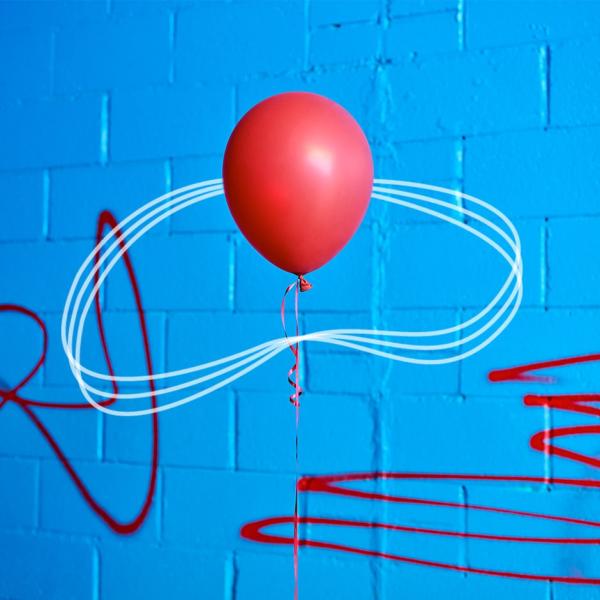 A red balloon with a bright blue background, surrounded by white lines