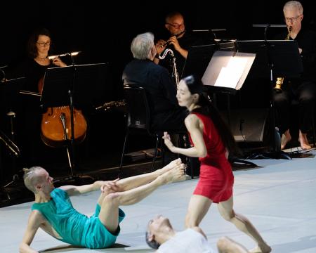dances in front of the musicians