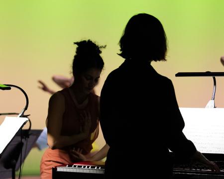 silhouetted pianist and dancer 