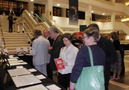 Attendees consider their auction bids