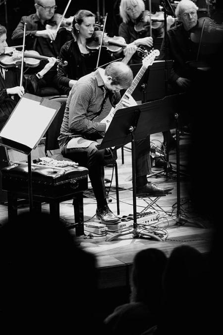 The London Sinfonietta and guitarist Wojciech Błażejczyk performing at the Queen Elizabeth Hall in Leaning East