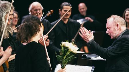 Composer Paweł Mykietyn applauding the London Sinfonietta