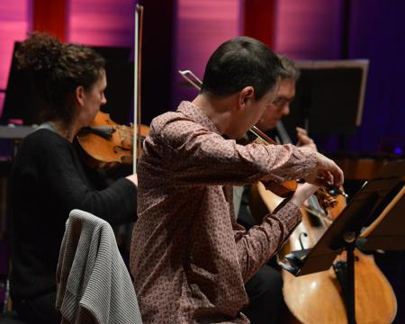 An image of violinists at A Catalan Celebration rehearsal
