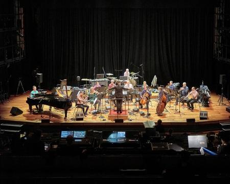 A wide shot of London Sinfonietta musicians performing at the Tapestries concert