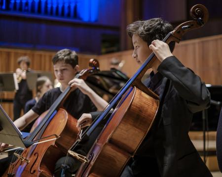 An image of two school pupils playing the cello at the London Sinfonietta Sound Out concert