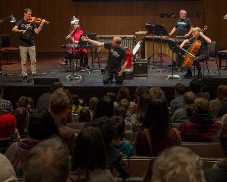 A wide shot of musicians and audience at a London Sinfonietta family concert