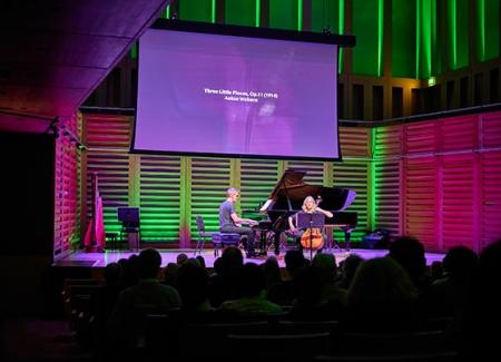 Turning Points: Takemitsu concert photo, stage with green and purple lighting