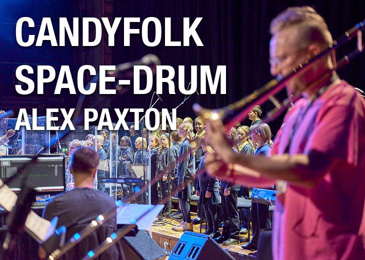 Alex Paxton in the foreground performing candyfolk space drum