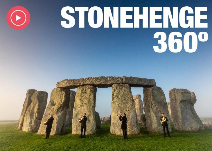 Wide shot of Stonehenge with four London Sinfonietta musicians standing in front of it